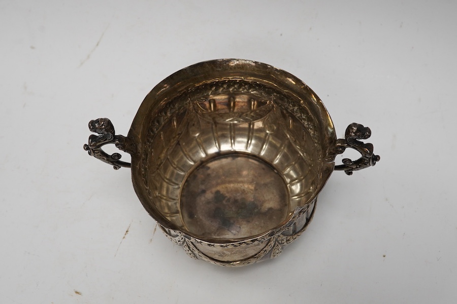 A late Victorian repousse silver porringer, maker JR, London 1884, height 82mm, 3.8oz. Condition - poor